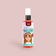 Botella de 120ml del Perfume Capilar Kaba Confidente, con etiqueta naranja-rosada y dibujo, fragancia herbal para controlar frizz y dar brillo al cabello.